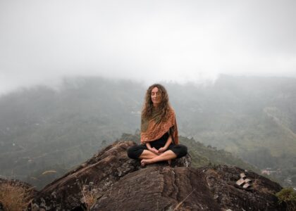 Woman breathwork on a mountain