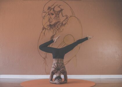 Woman yoga standing on head